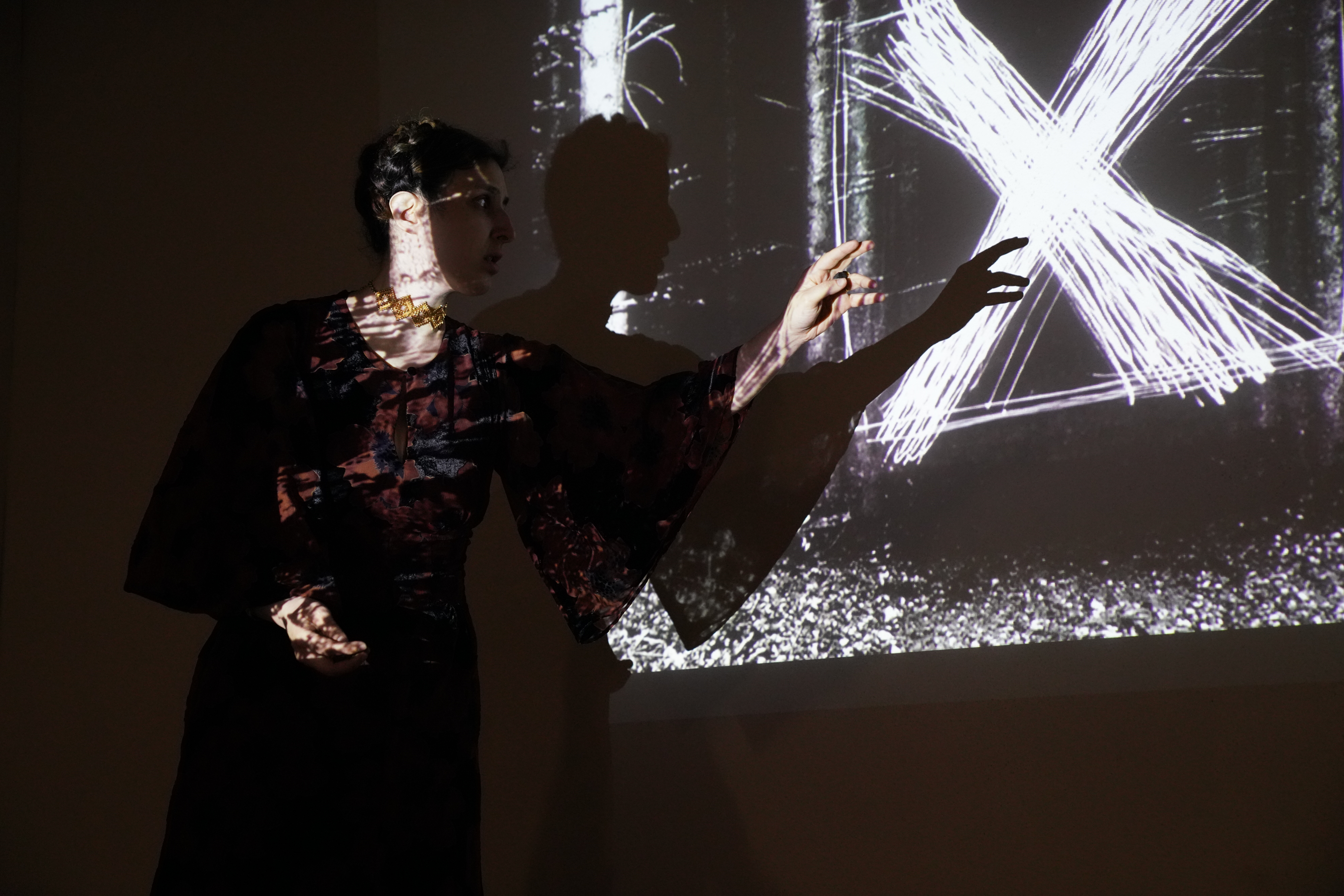 Performer before projected forest imagery at Picoas Metro Station